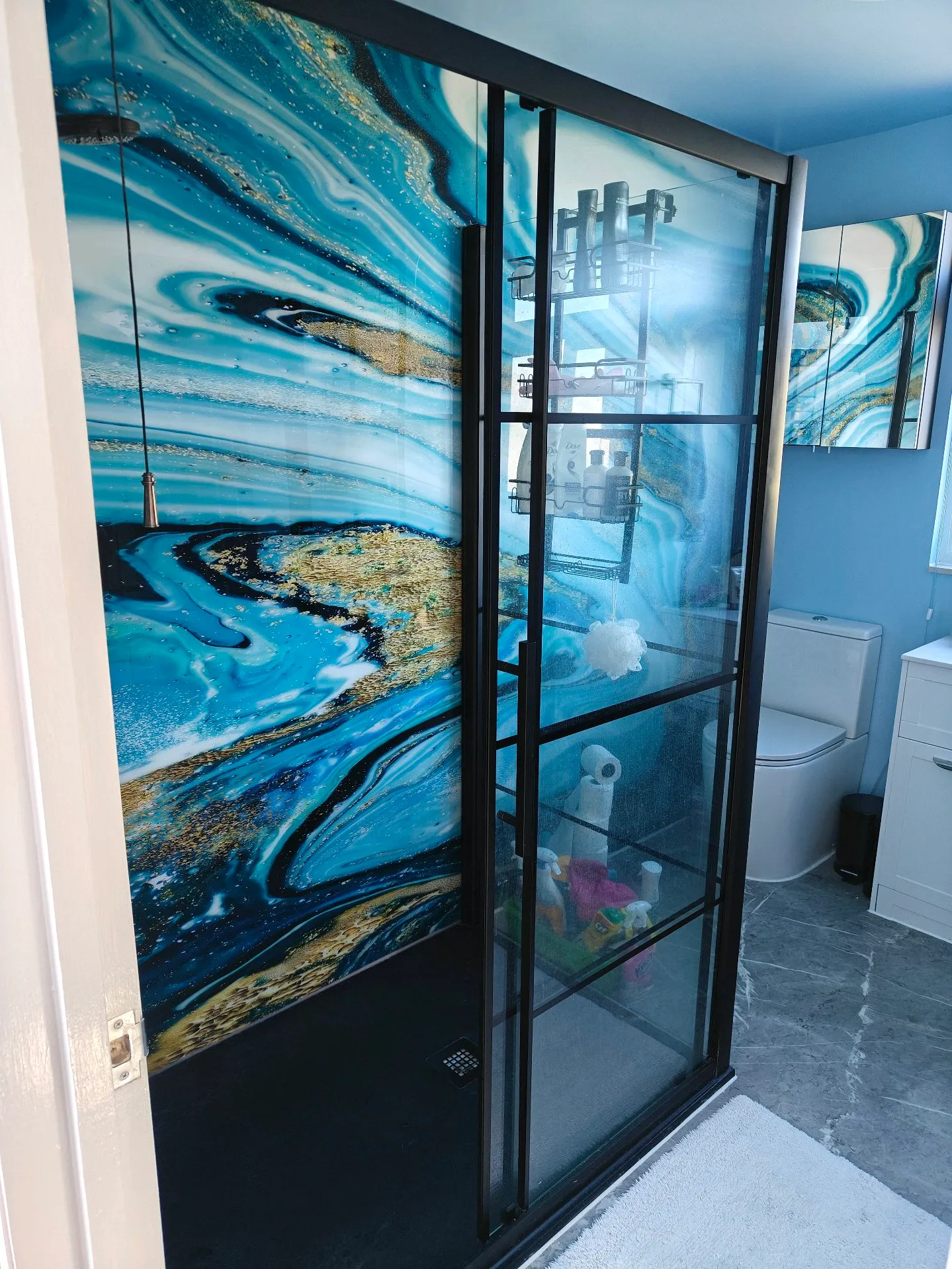After: modern black crittall-style frame with blue marble effect panels